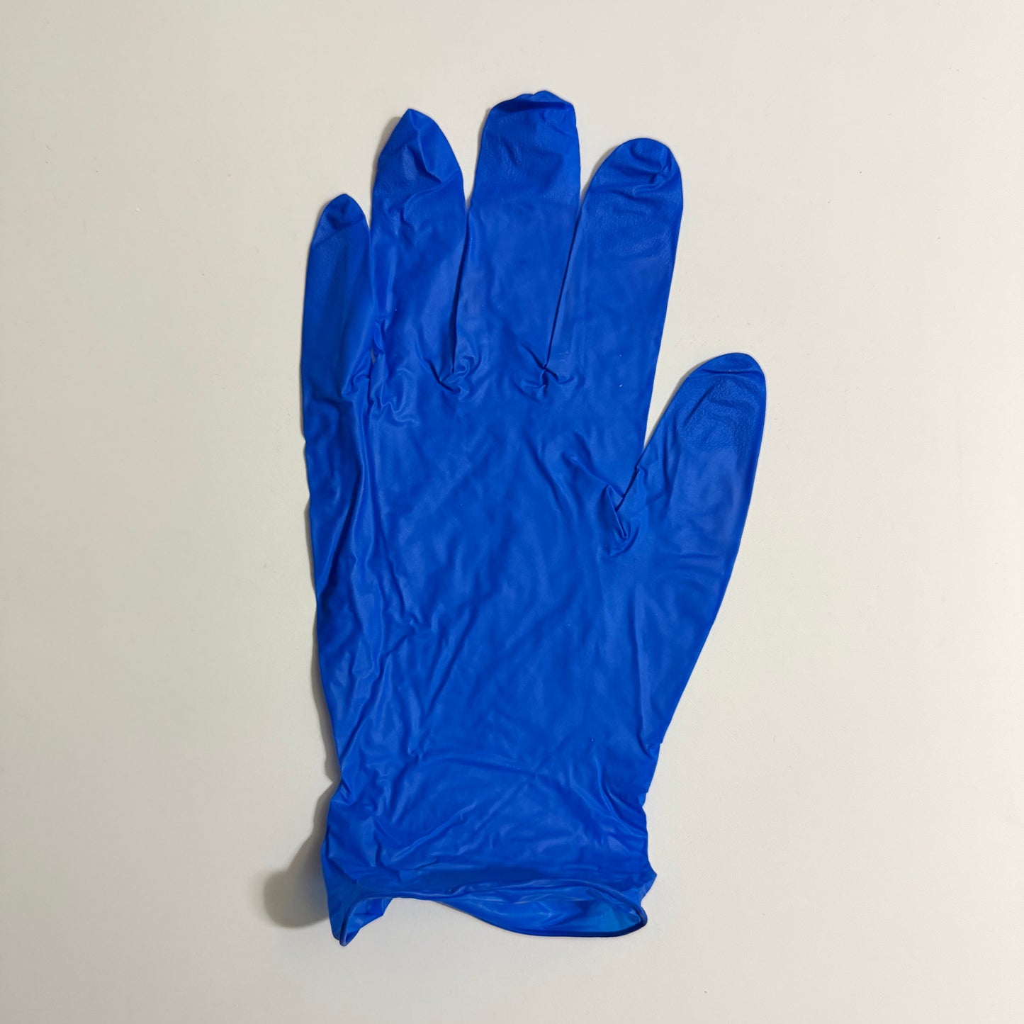 Blossom Dark Blue Nitrile Powder-Free Exam Gloves with textured fingertips for enhanced grip