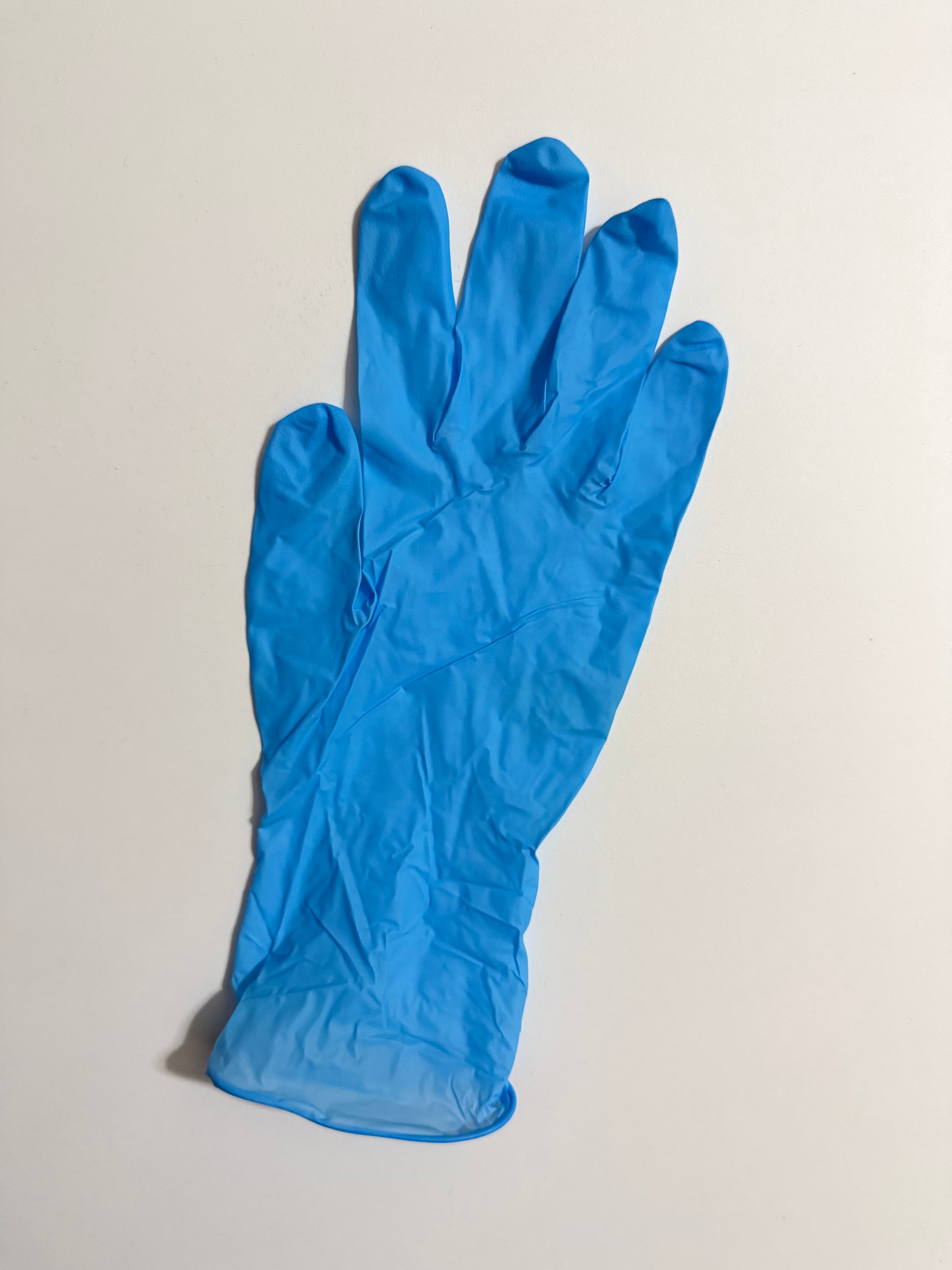 Wholesale Blossom brand soft blue nitrile examination gloves imported from Hong Kong distributor Pacific Blossom for Indian dental suppliers