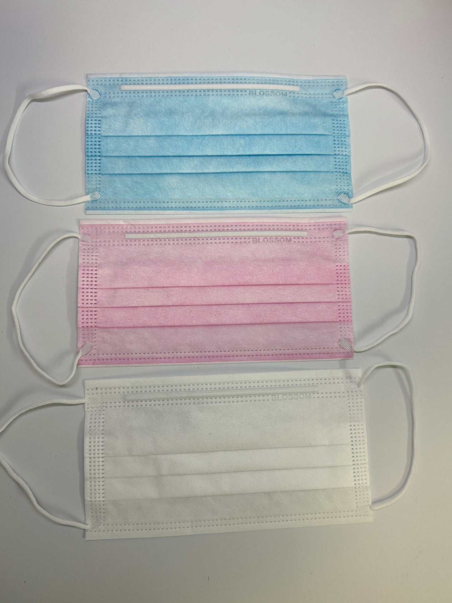 pink, blue and white face masks