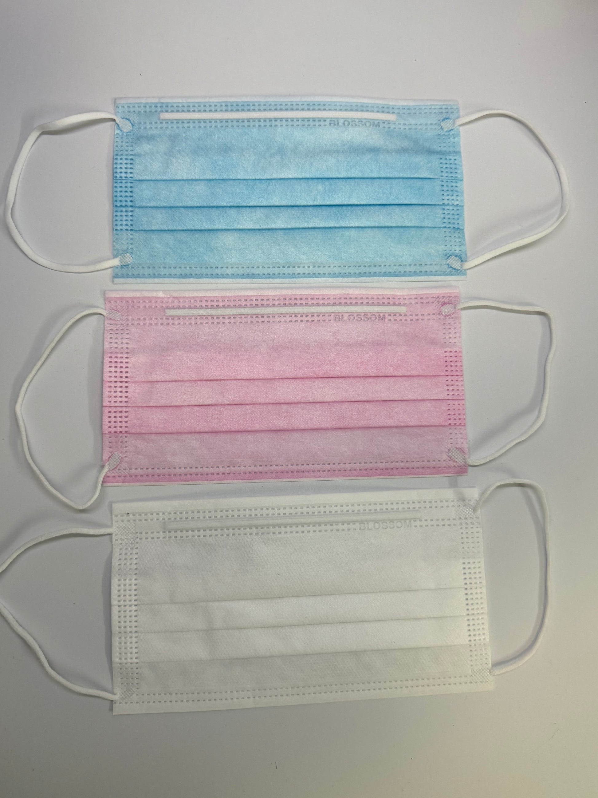 pink, blue and white face masks